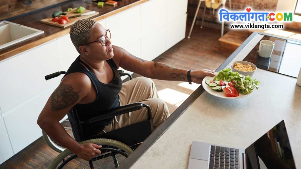 a wheelchair user holding a plate full of salad